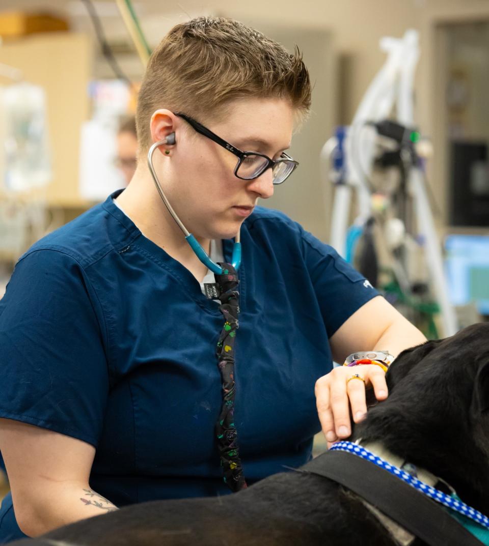 technician taking patient's heart rate
